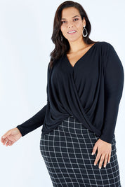 Model Lauren wearing size 16 of the Belle High Low Knit in colour Black (Black), from the front, cropped image