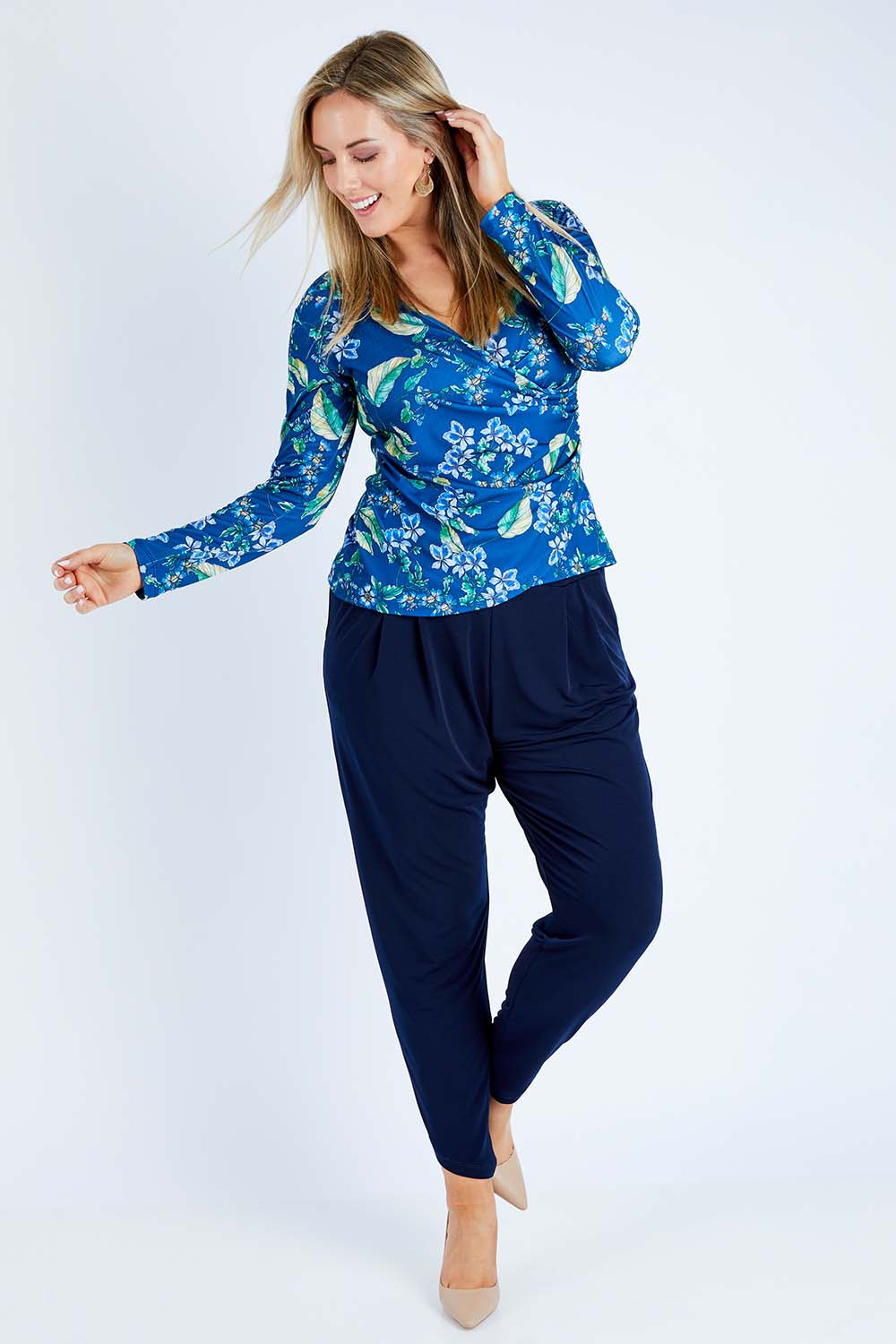 Model Jess wearing size 12 of the Belle Taper Pant in colour Navy (Blue), from the front, showing the whole outfit