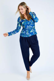 Model Jess wearing size 12 of the Belle Taper Pant in colour Navy (Blue), from the front, showing the whole outfit