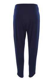 Product shot of the Belle Taper Pant in colour Navy (Blue), from the back