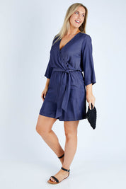 Model Jess wearing size 14 of the Belle Tencel Playsuit in colour Denim (Blue), from the front, showing the whole outfit