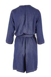 Product shot of the Belle Tencel Playsuit in colour Denim (Blue), from the back
