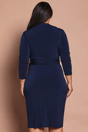 Model Ashleigh wearing size 16 of the Belle Basic Wrap Dress in colour Navy (Blue), from the front, cropped image