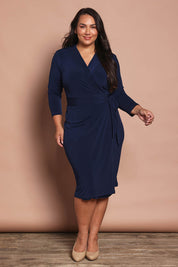 Model Ashleigh wearing size 16 of the Belle Basic Wrap Dress in colour Navy (Blue), from the front, showing the whole outfit