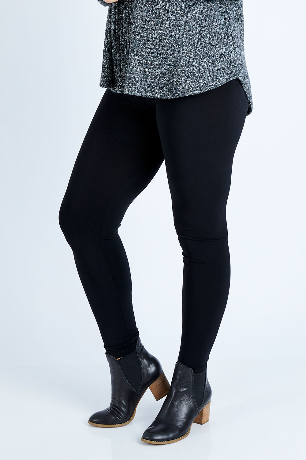Model Jess wearing size 12 of the Belle Legging in colour Black (Black), from the front, cropped image