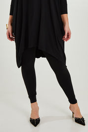 Model Maddy wearing size 16 of the Belle Legging in colour Black (Black), from the front, cropped image