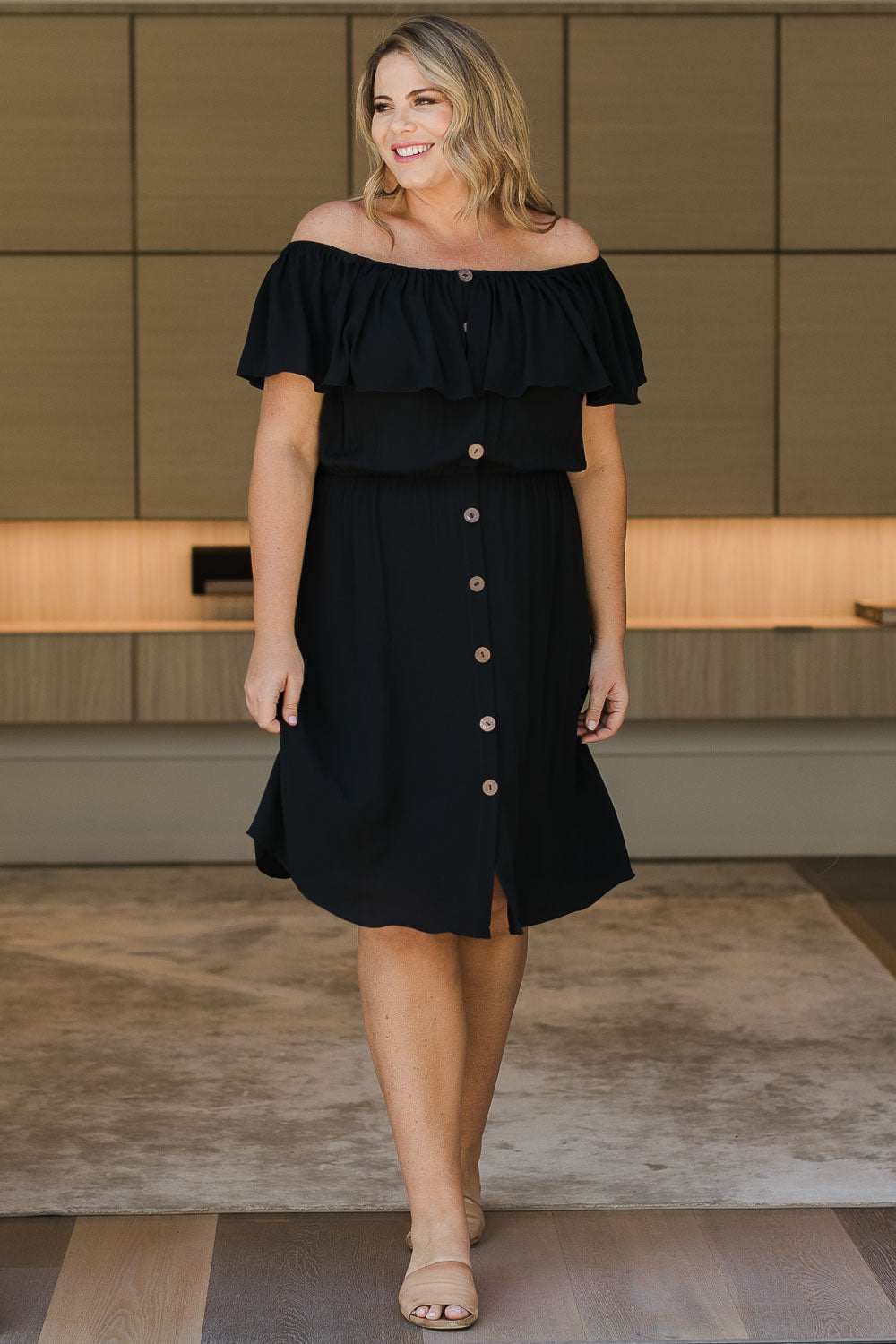 Model Fiona wearing size 16 of the Belle Off Shoulder Button Through Dress in colour Black (Black), from the front, showing the whole outfit