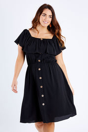 Model Laura wearing size 12 of the Belle Off Shoulder Button Through Dress in colour Black (Black), from the front, cropped image