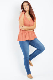 Model Laura wearing size 12 of the Belle Tie Shoulder Top in colour Clay, from the front, showing the whole outfit
