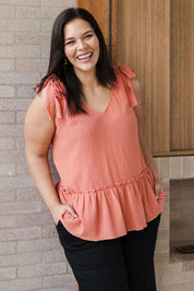 Model Lauren wearing size 16 of the Belle Tie Shoulder Top in colour Clay, from the front, showing the whole outfit