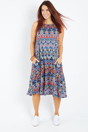 Model Laura wearing size 14 of the Belle Aztec Trapeze Dress in colour Aztec (Red), from the front, showing the whole outfit