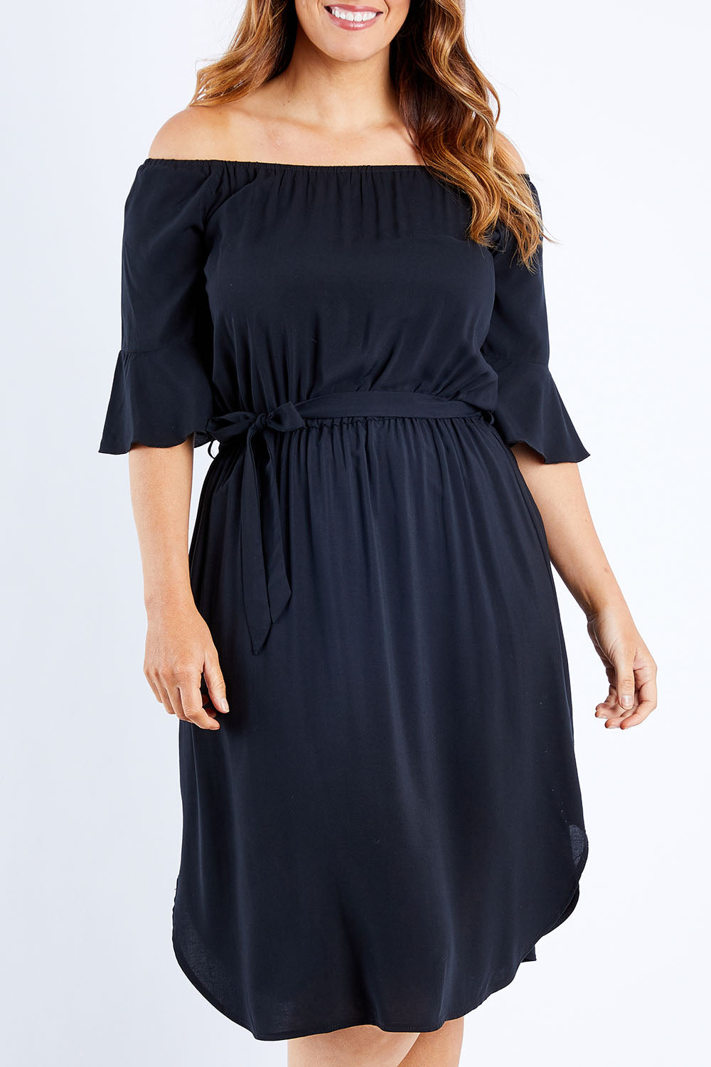 Model Laura wearing size 12 of the Belle Waist Tie Dress in colour Black (Black), from the front, cropped image