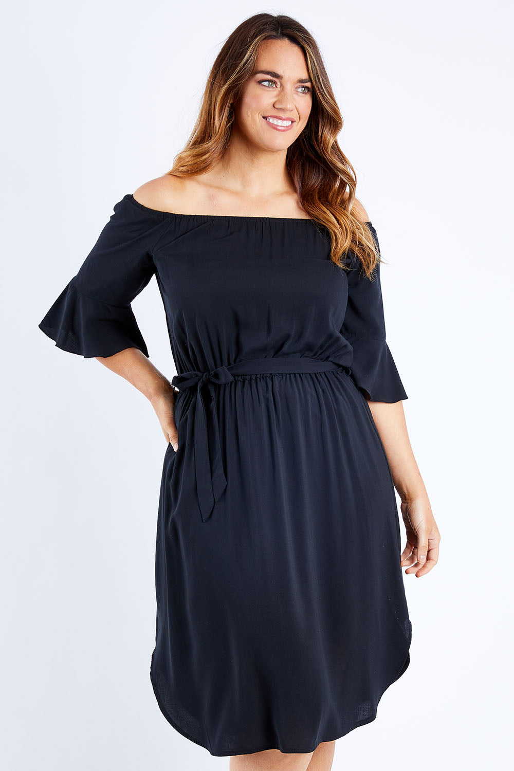 Model Laura wearing size 12 of the Belle Waist Tie Dress in colour Black (Black), from the front, cropped image