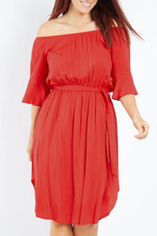 Model Laura wearing size 12 of the Belle Waist Tie Dress in colour Red (Red), from the front, cropped image