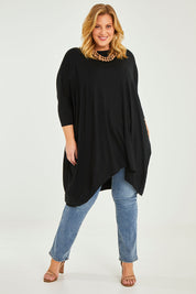 Model Caitlin wearing size L of the Belle Essential Throw Over in colour Black (Black), from the front, showing the whole outfit