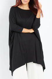 Model Laura wearing size M of the Belle Essential Throw Over in colour Black (Black), from the front, cropped image
