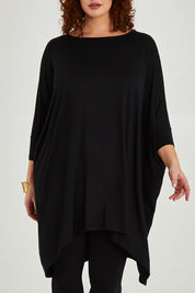Model Maddy wearing size L of the Belle Essential Throw Over in colour Black (Black), from the front, cropped image