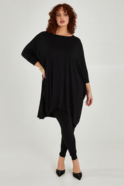Model Maddy wearing size L of the Belle Essential Throw Over in colour Black (Black), from the front, showing the whole outfit