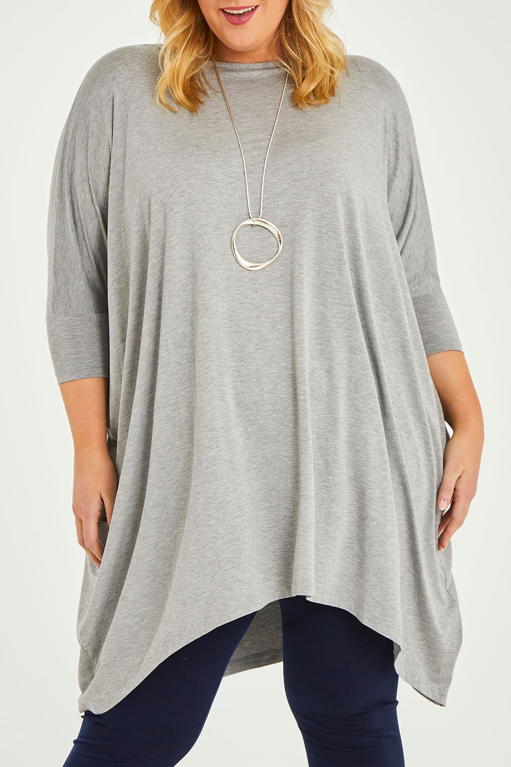 Model Caitlin wearing size L of the Belle Essential Throw Over in colour Greymarle (Grey), from the front, cropped image