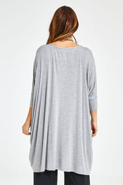 Model Laura wearing size M of the Belle Essential Throw Over in colour Greymarle (Grey), from the back