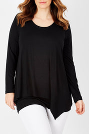 Model Laura wearing size 12 of the Belle Forgiver Tunic in colour Black (Black), from the front, cropped image
