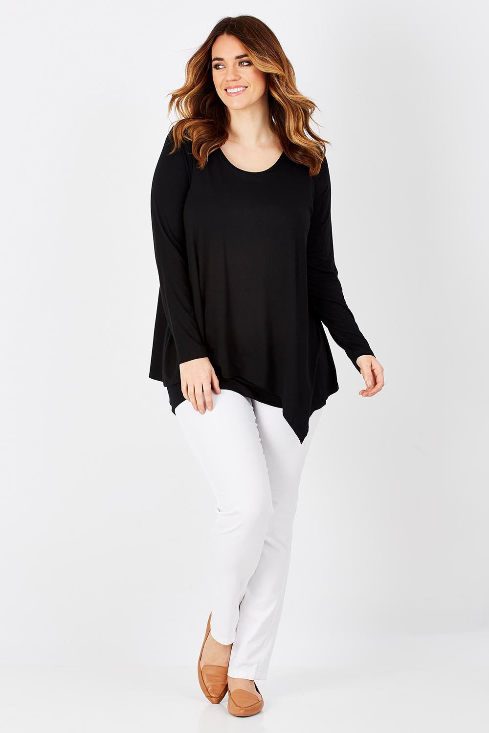 Model Laura wearing size 12 of the Belle Forgiver Tunic in colour Black (Black), from the front, showing the whole outfit