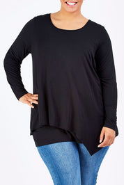 Model Shareefa wearing size 18 of the Belle Forgiver Tunic in colour Black (Black), from the front, cropped image