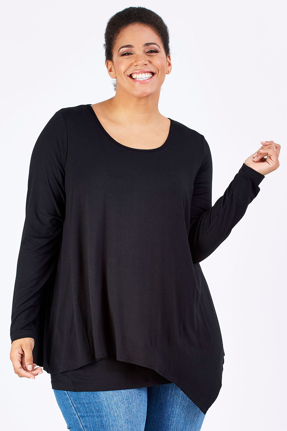 Model Shareefa wearing size 18 of the Belle Forgiver Tunic in colour Black (Black), from the front, cropped image