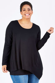 Model Shareefa wearing size 18 of the Belle Forgiver Tunic in colour Black (Black), from the front, cropped image