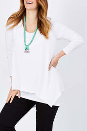 Model Laura wearing size 12 of the Belle Forgiver Tunic in colour White (White), from the front, cropped image