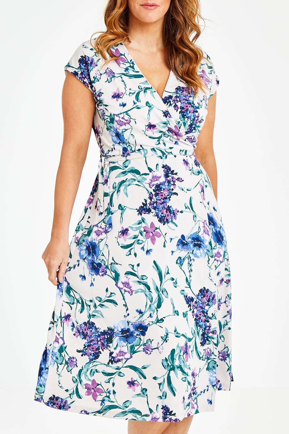 Model Laura wearing size 12 of the Belle Lavender Floral Wrap Dress in colour Lavender (Purple), from the front, cropped image