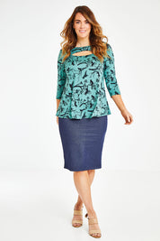 Model Laura wearing size 12 of the Belle Bird Printed Top in colour Bird (Green), from the front, showing the whole outfit