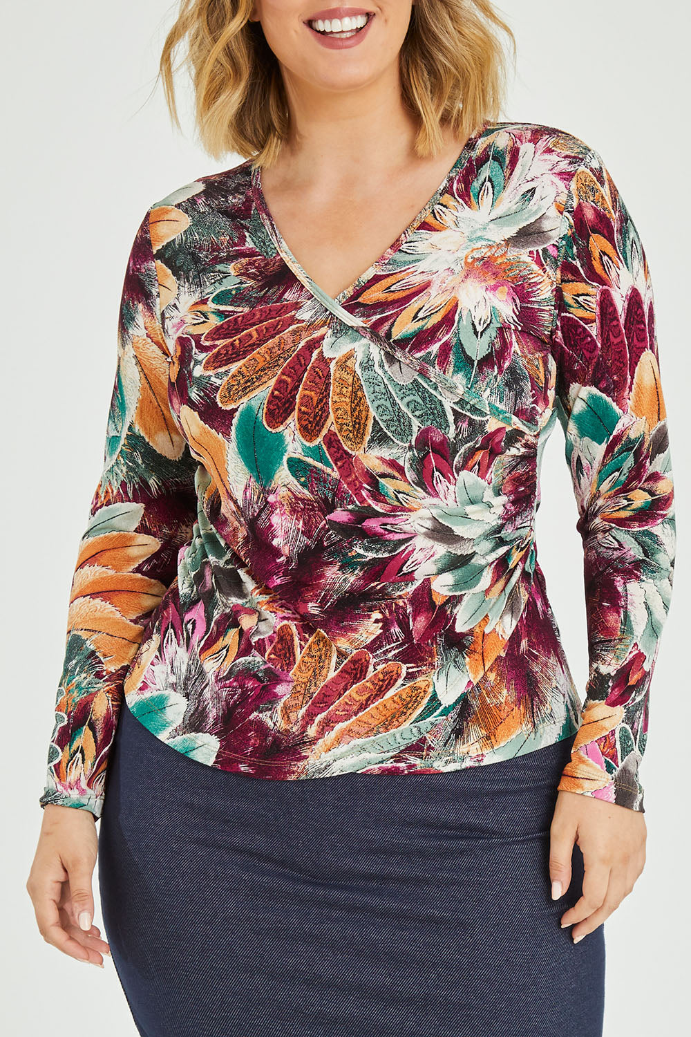 Model Jess wearing size 12 of the Belle Feathers Top in colour Feathers (Green), from the front, cropped image