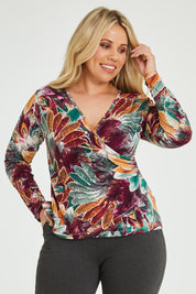 Model Katie wearing size 16 of the Belle Feathers Top in colour Feathers (Green), from the front, cropped image