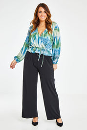 Model Laura wearing size 12 of the Belle Tie Dye Top in colour Tiedye (Blue), from the front, showing the whole outfit