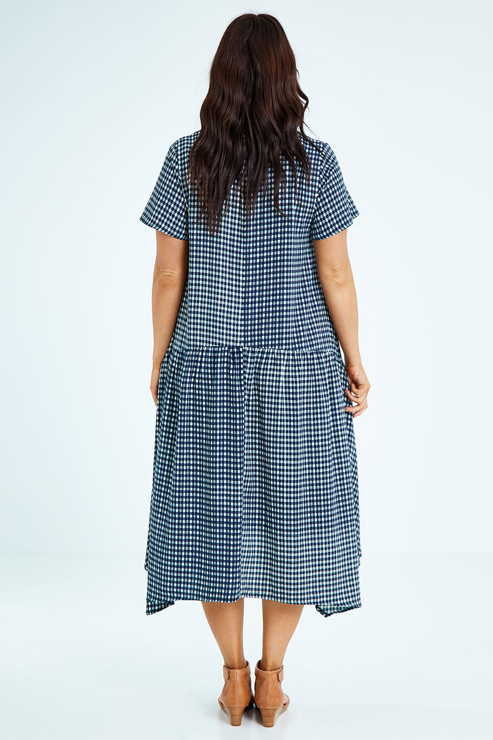 Model Laura wearing size 12 of the Belle Check Maxi Dress in colour Check (Blue), from the back