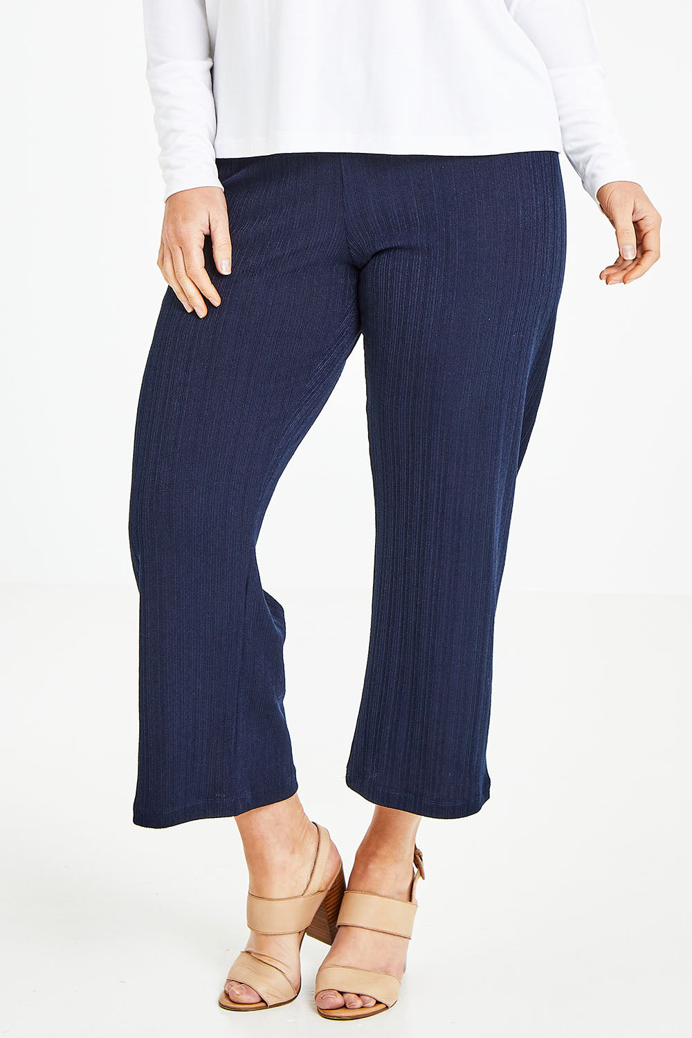 Model Laura wearing size 12 of the Belle Fashion Knit Pant in colour Navy (Blue), from the front, cropped image