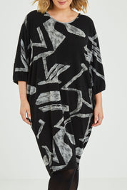 Model Jess wearing size 12 of the Belle Abstract Warm Knit Dress in colour Abstract (Black), from the front, cropped image