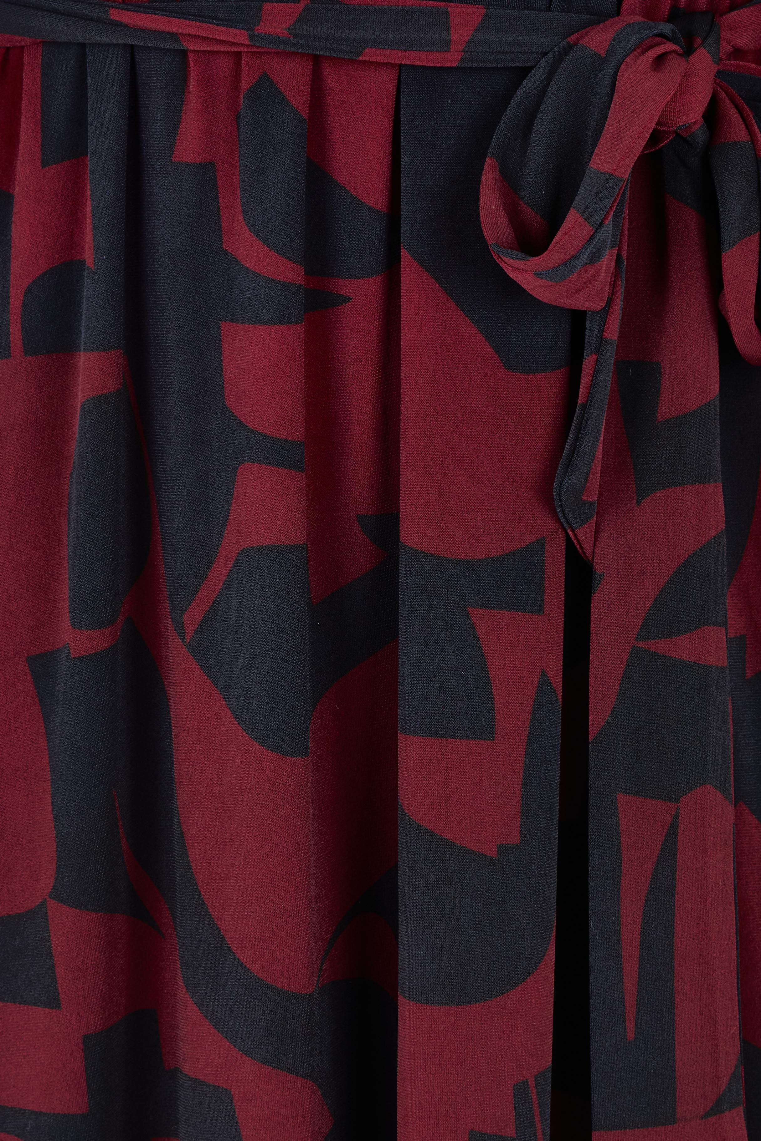 Product shot of the Belle Printed Long Sleeve Mock Wrap Dress in colour Winenavy (Blue), detail