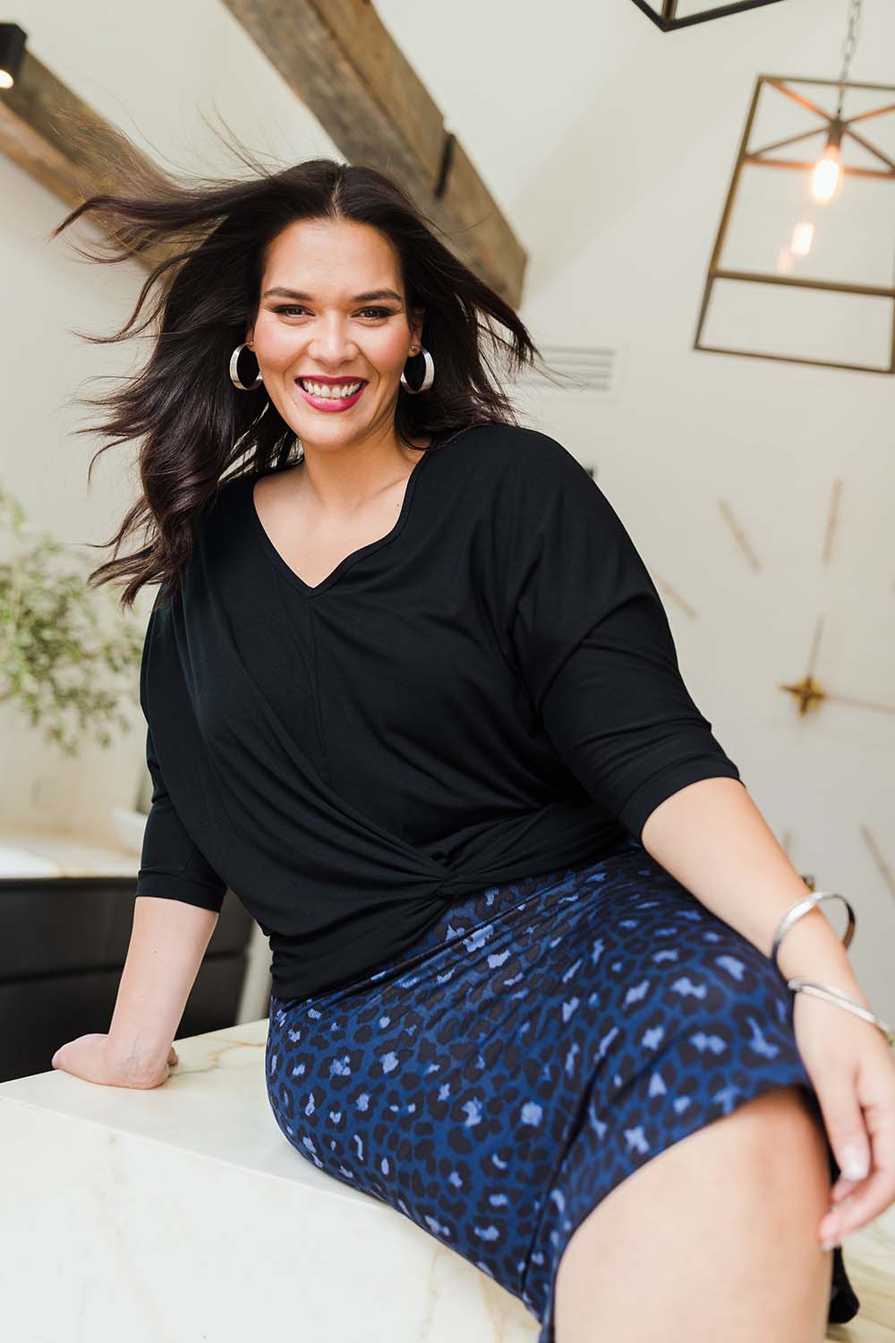 Model Lauren wearing size 16 of the Belle Animal Print Pencil Skirt in colour Animal (Blue), from the front, showing the whole outfit