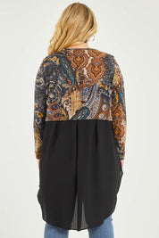 Model Katie wearing size 16 of the Belle Paisley Mixed Fabric Tunic in colour Paisley, from the back