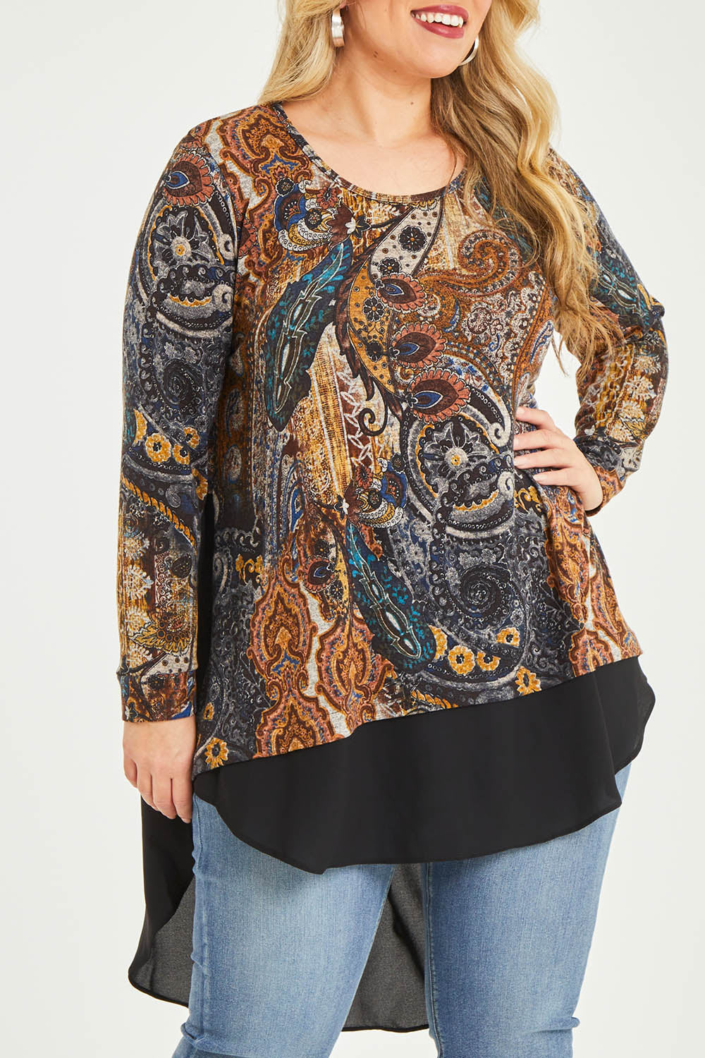 Model Katie wearing size 16 of the Belle Paisley Mixed Fabric Tunic in colour Paisley, from the front, cropped image