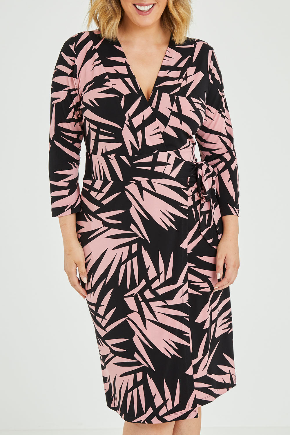 Model Jess wearing size 12 of the Belle Jungle Print Wrap Dress in colour Jungle (Black), from the front, cropped image