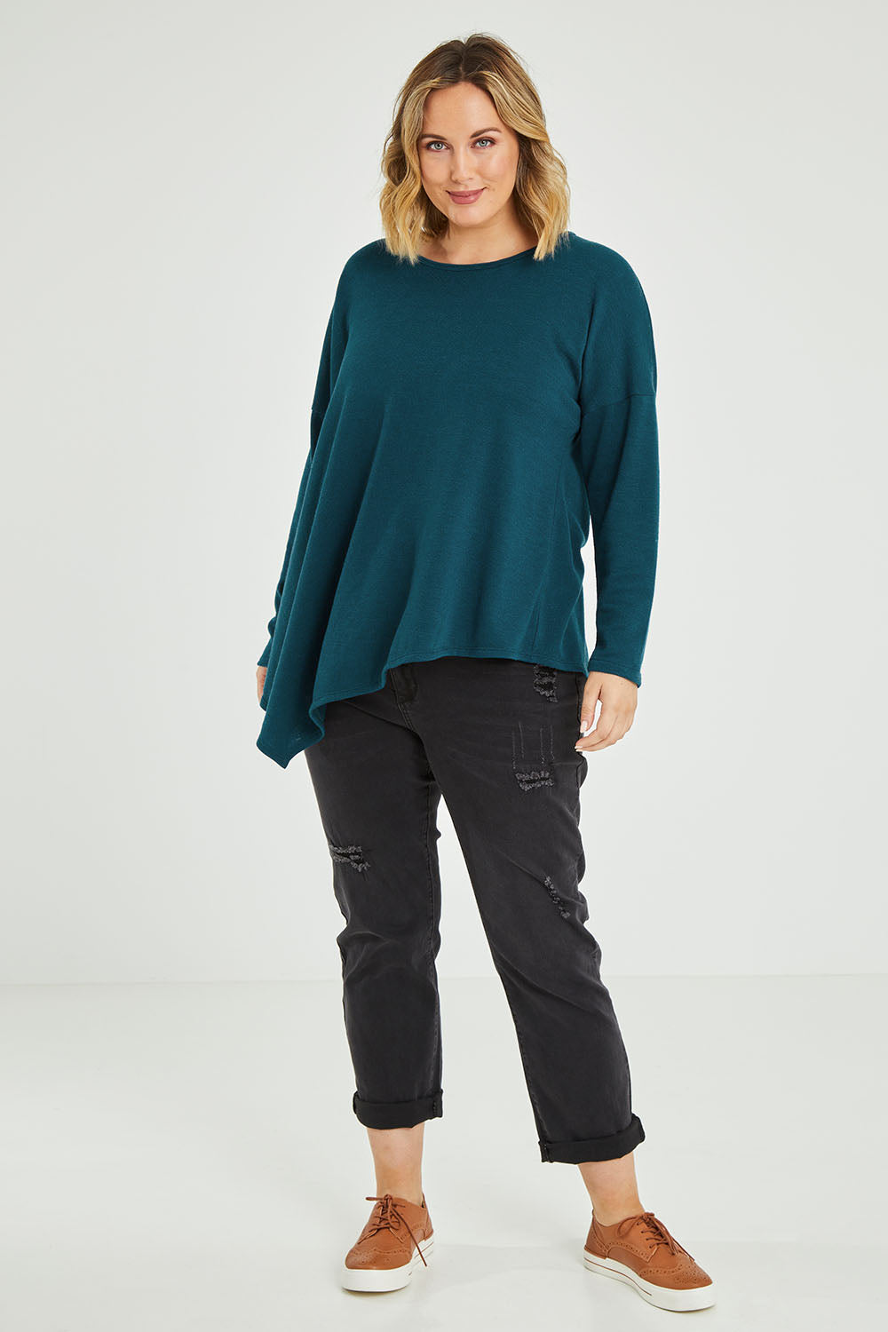Model Jess wearing size 12 of the Belle Winter Warm Knit Throw Over in colour Teal (Blue), from the front, showing the whole outfit