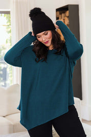 Model Lauren wearing size 16 of the Belle Winter Warm Knit Throw Over in colour Teal (Blue), from the front, showing the whole outfit