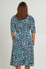 Model Monique wearing size 14 of the Belle X Over Full Skirt Dress in colour Bluegreen (Blue), from the back
