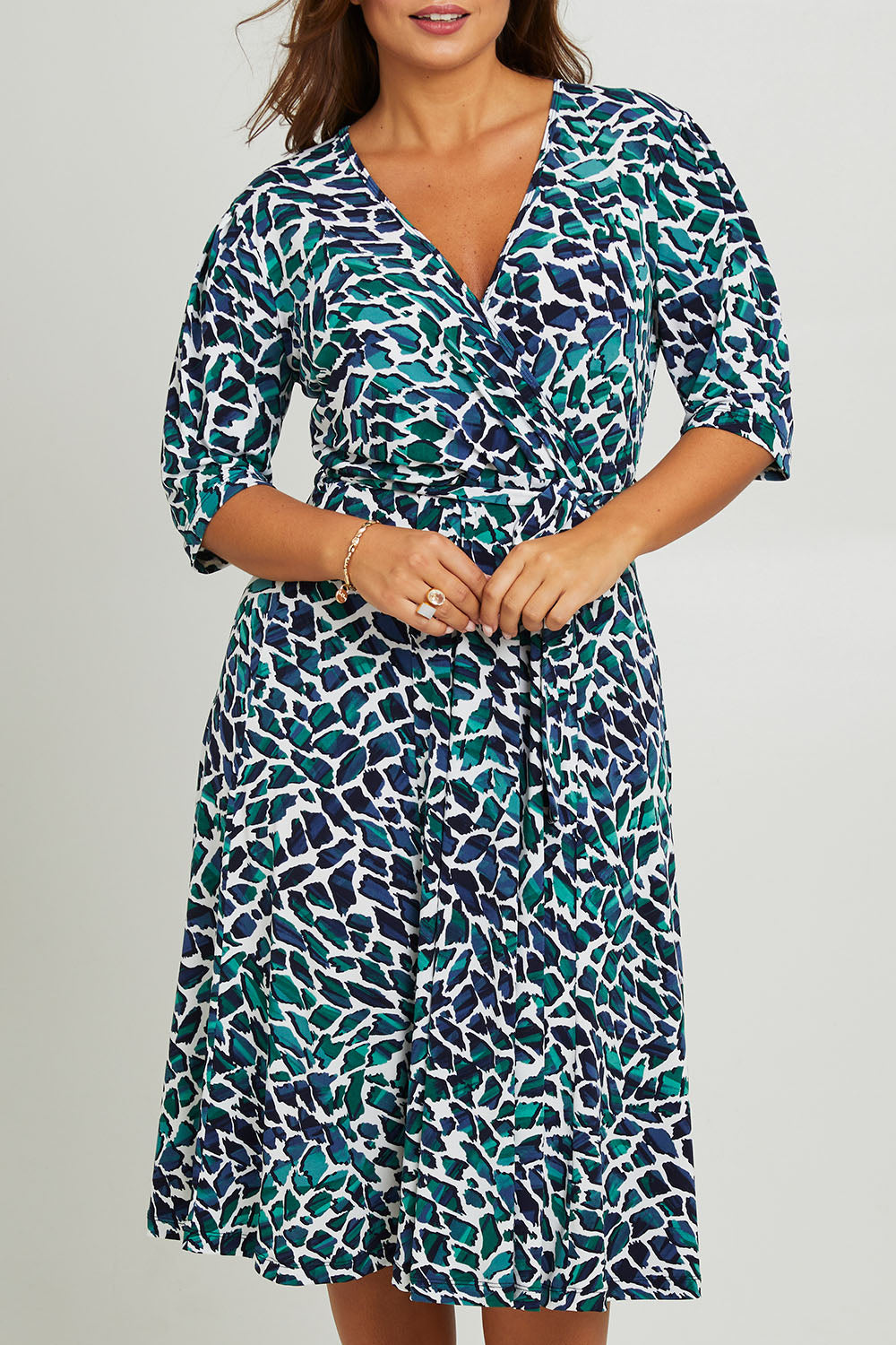 Model Monique wearing size 14 of the Belle X Over Full Skirt Dress in colour Bluegreen (Blue), from the front, cropped image