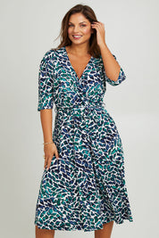 Model Monique wearing size 14 of the Belle X Over Full Skirt Dress in colour Bluegreen (Blue), from the front, cropped image