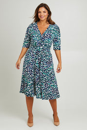 Model Monique wearing size 14 of the Belle X Over Full Skirt Dress in colour Bluegreen (Blue), from the front, showing the whole outfit