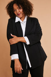 Model Alexis wearing size 16 of the Belle Long Line Ponte Jacket in colour Black (Black), from the front, showing the whole outfit